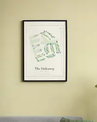 The Hideaway (Pete Dye & Clive Clark Courses) map print, framed in a room